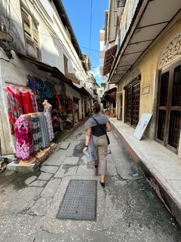 Walking the streets of Stone Town, appropriately covered